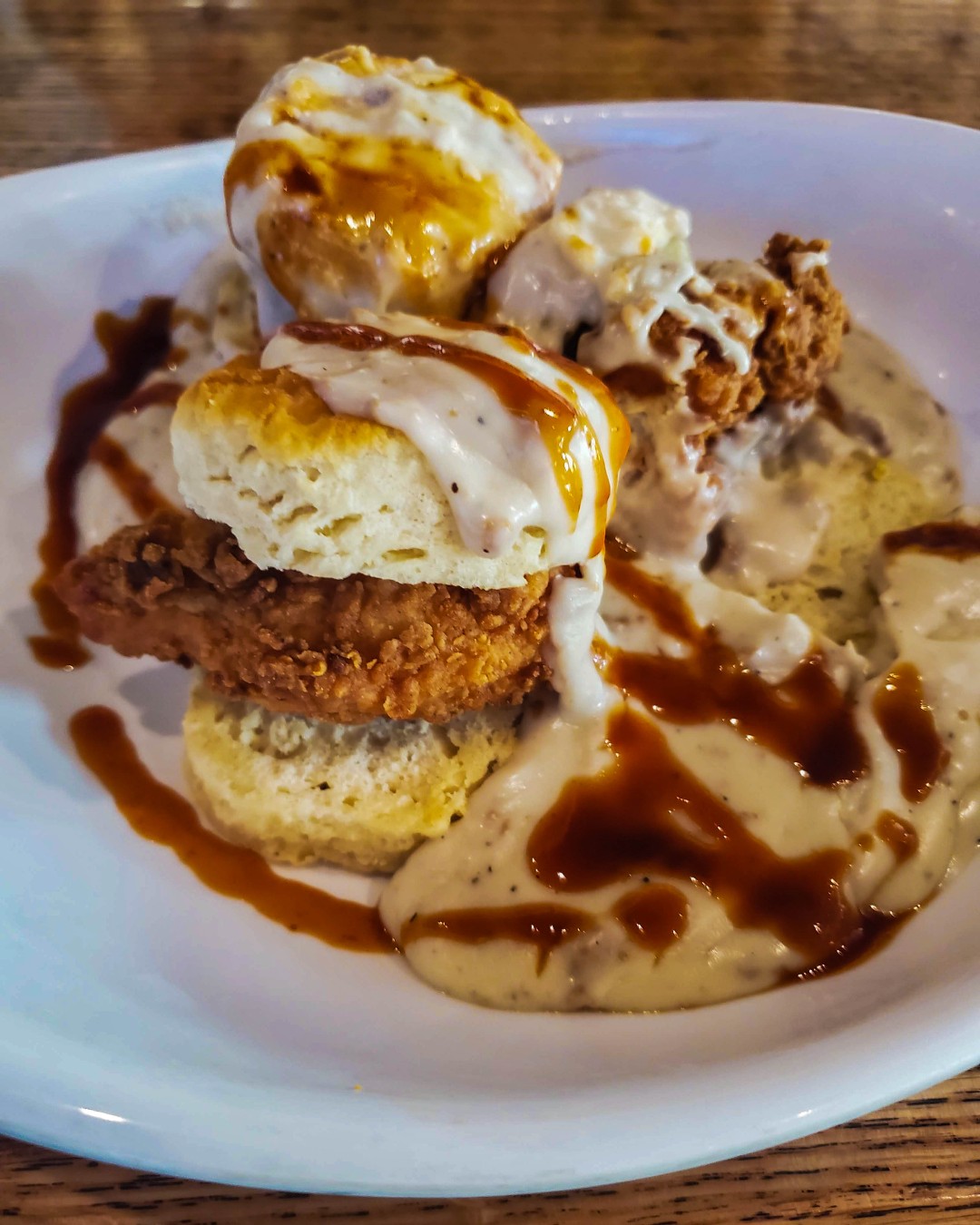A plate of chicken biscuits with grits