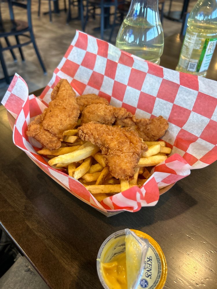 Chicken tenders with fries and dipping sauce
