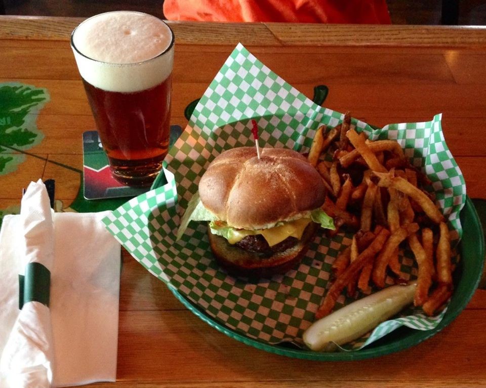 A burger, fries, and a glass of beer