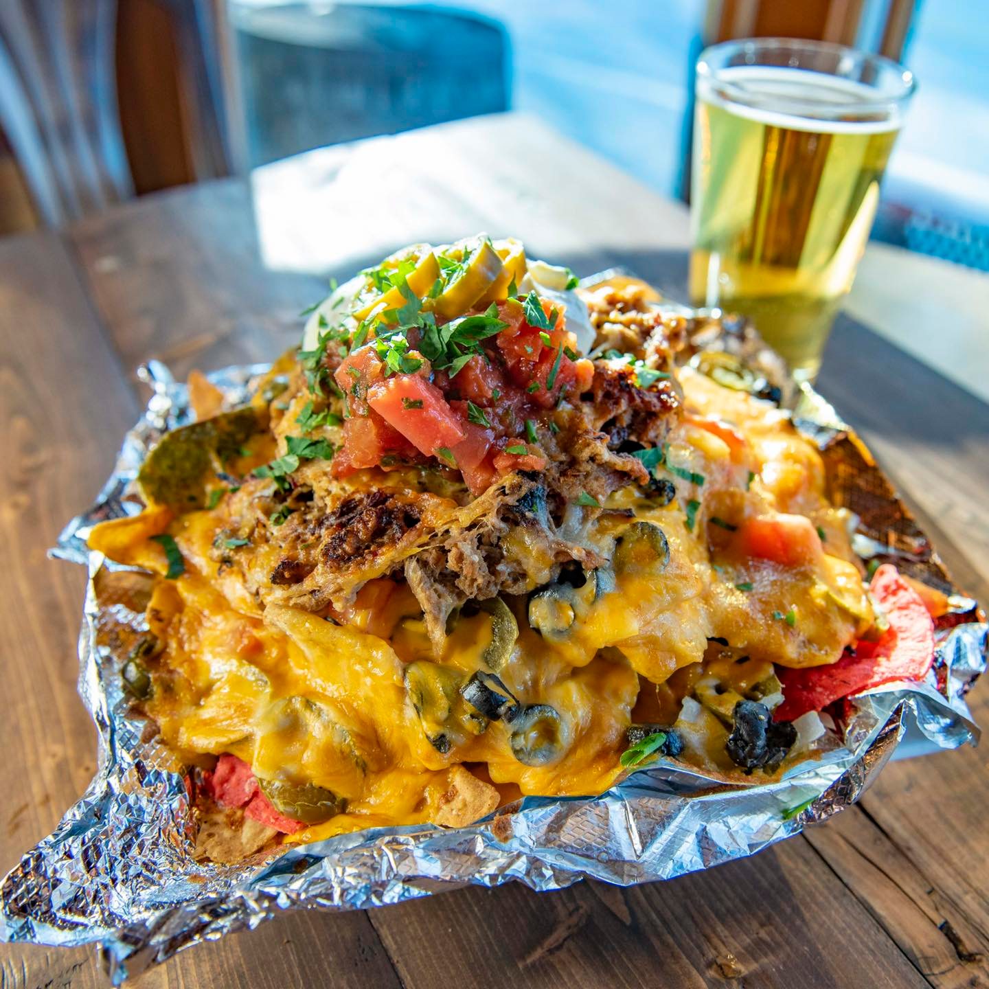Nachos with a glass of beer