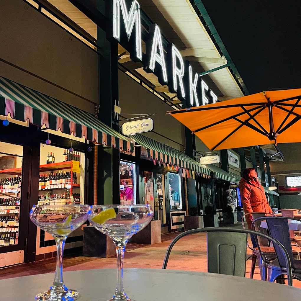 a two martinis on a table outside belvedere square market