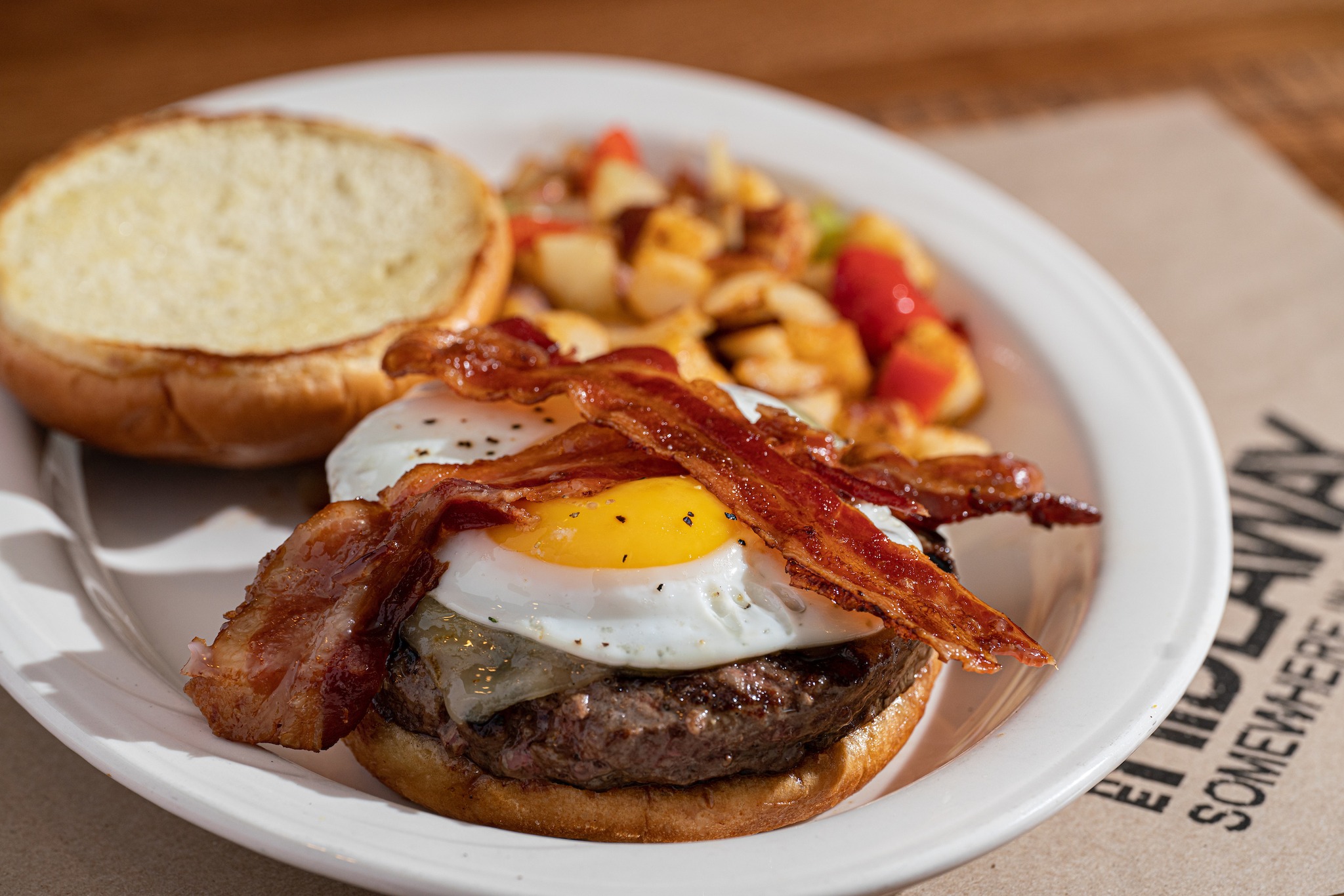 a breakfast burger with an egg and bacon