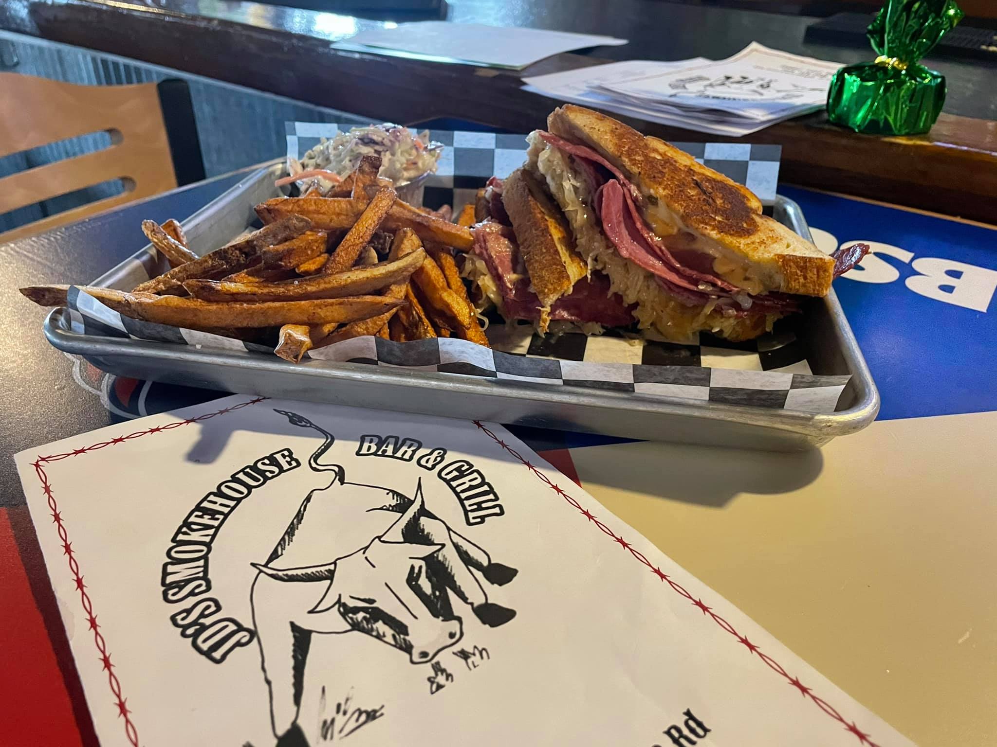 a sandwich with fries on a tray