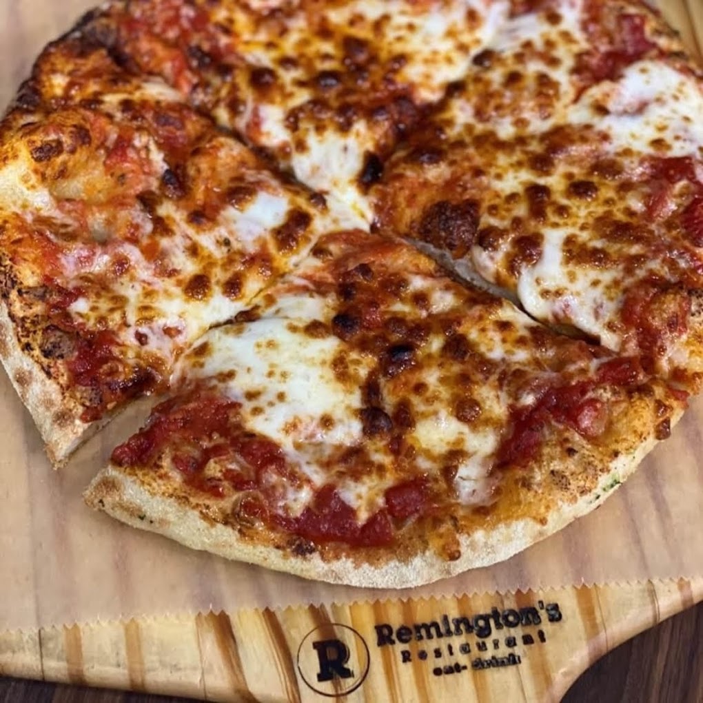 Cheese pizza on Remington's Pizza board