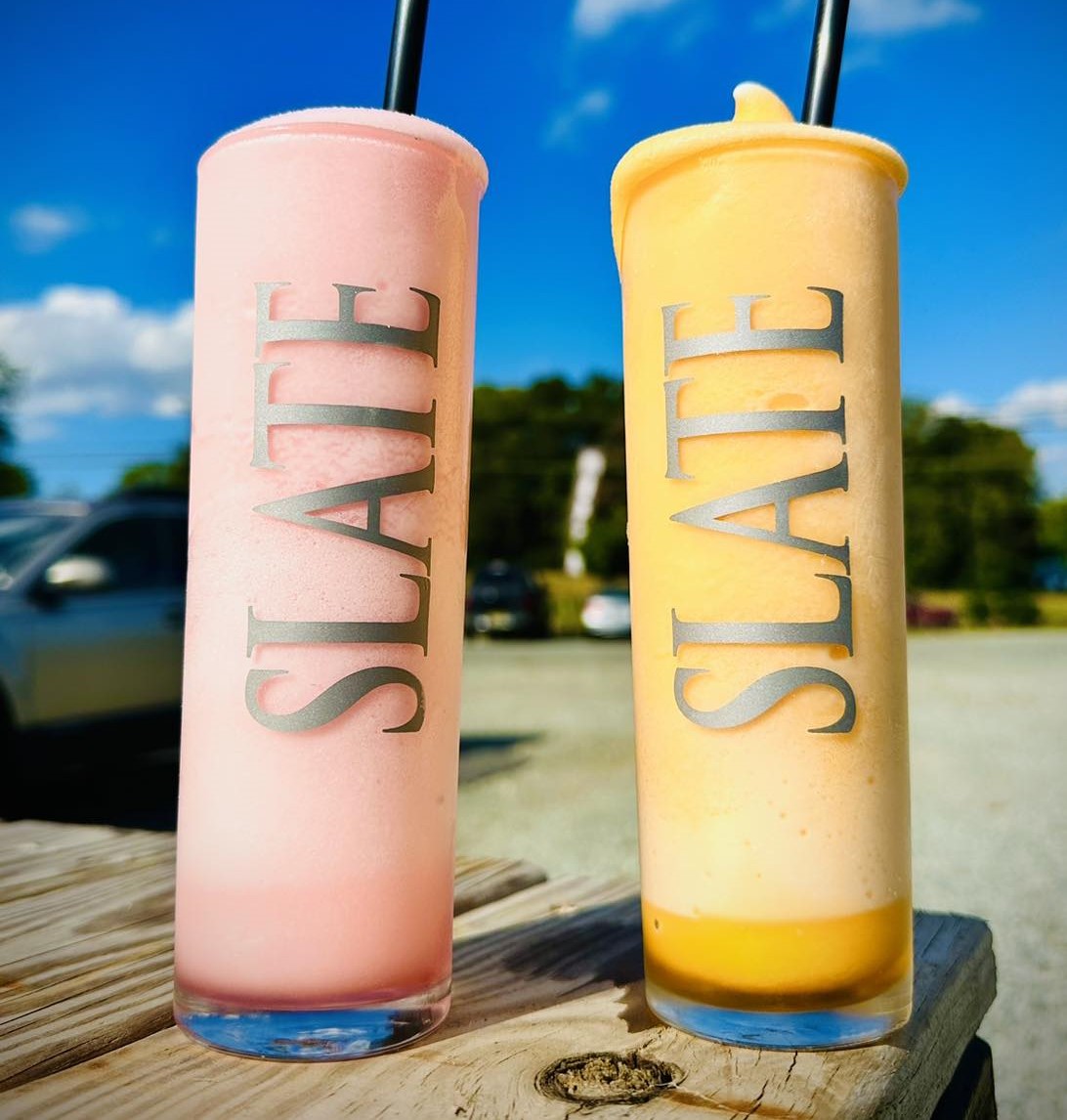 Two hard seltzer slushies, one each of cotton candy and egg custard