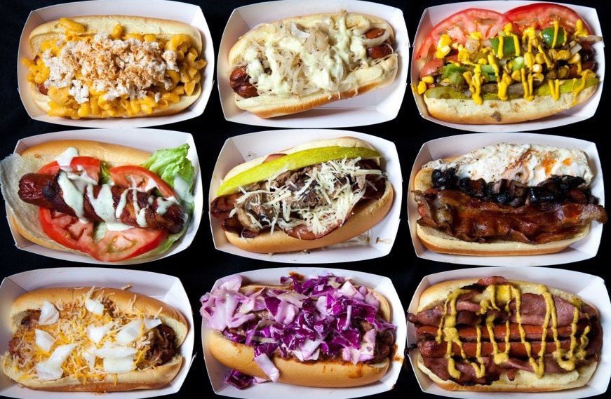 a group of hot dogs with different toppings