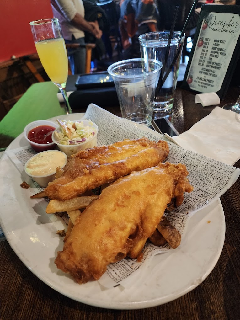 Fish and Chips on a plate with tartar and cocktail sauce