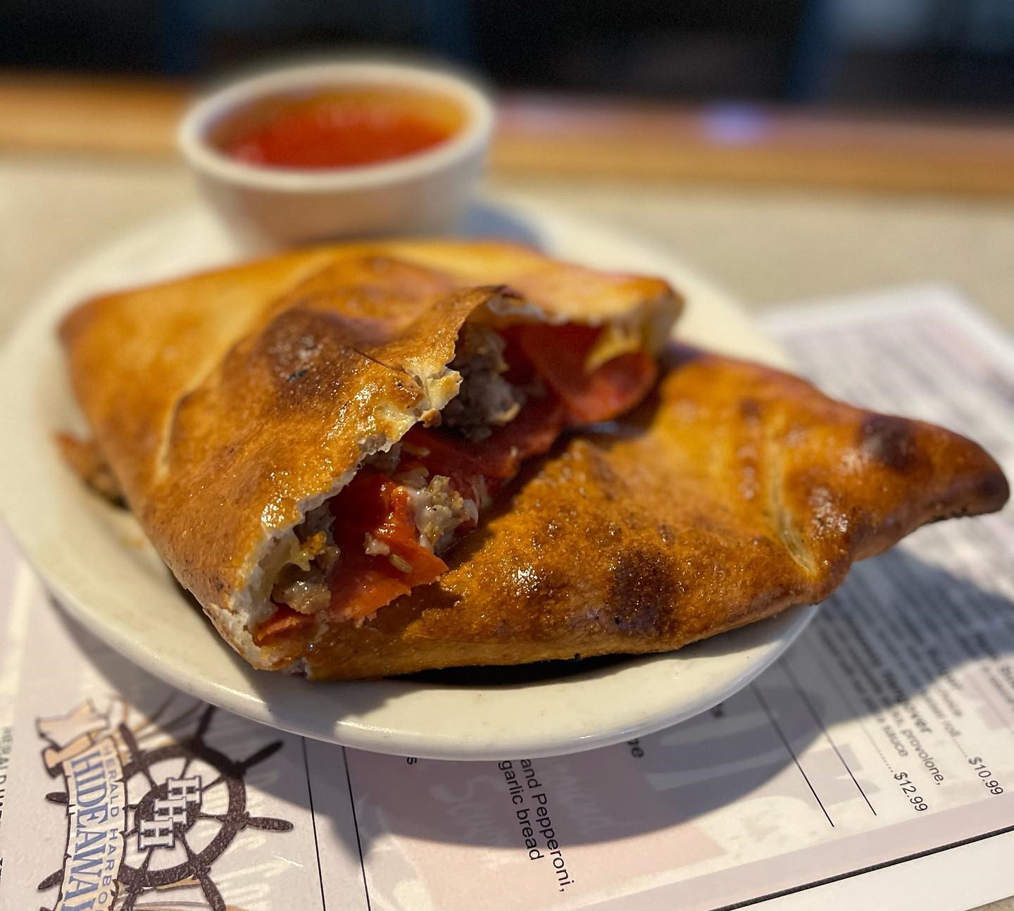 a plate of Colin’s pepperoni and sausage calzones