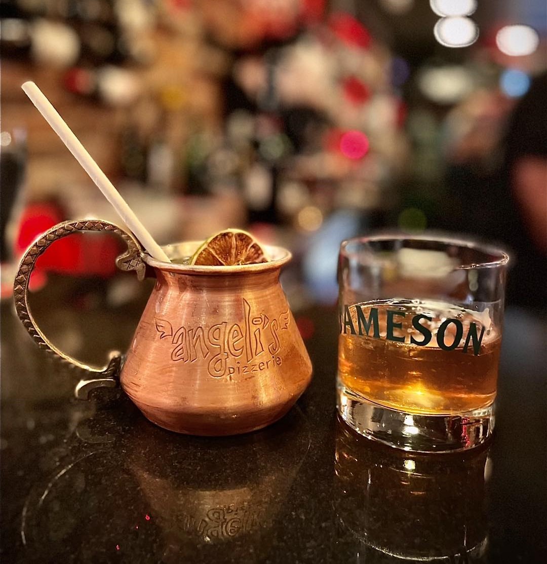 two cocktails, one in a glass and one in a copper mug