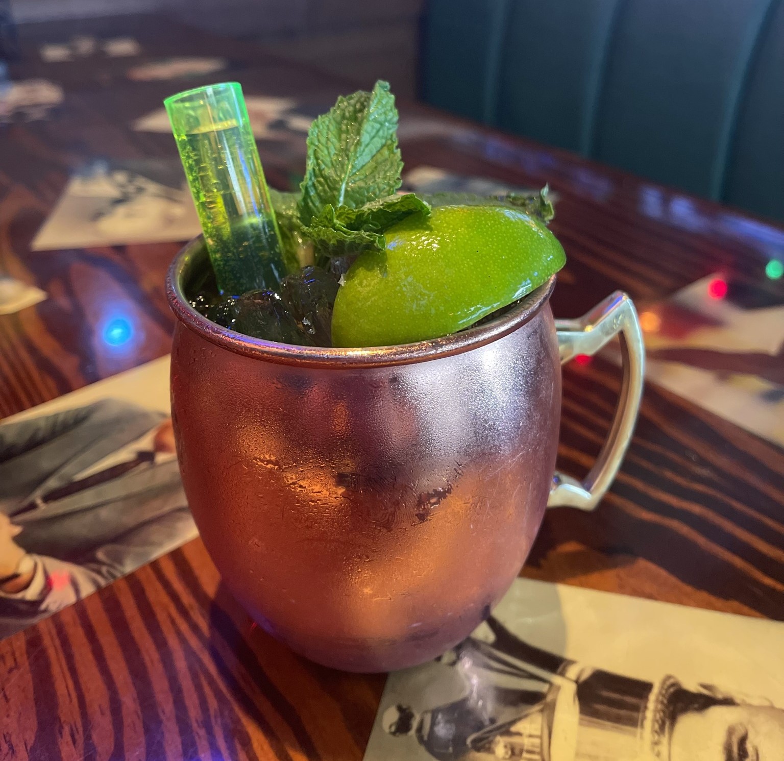 a Crown Royal Apple Mule with a spring of mint and a lime wedge