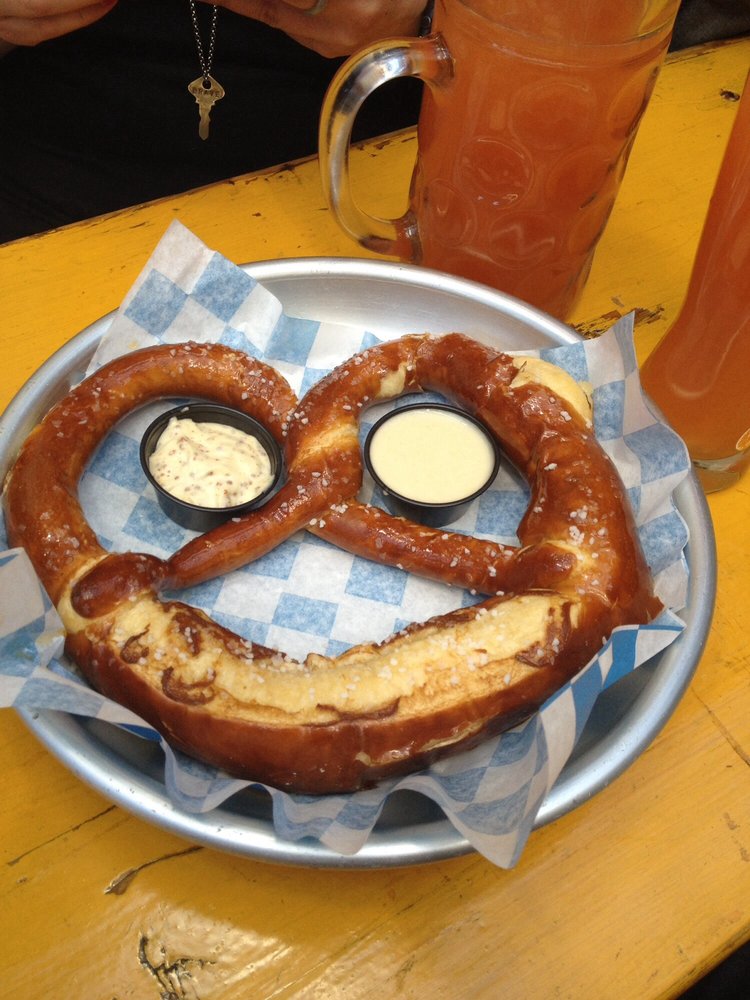 a large soft pretzel with dips