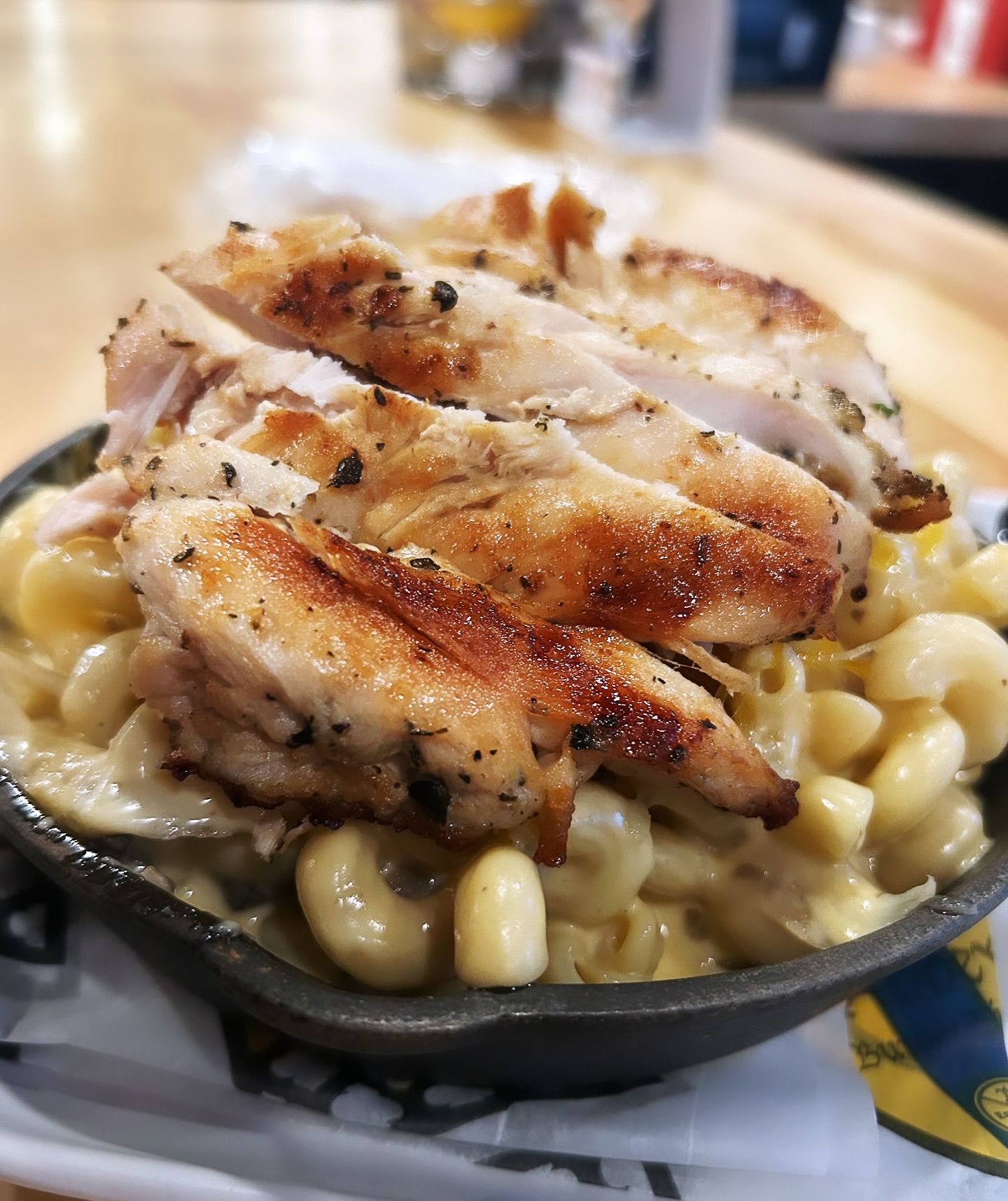 a bowl of mac and cheese with chicken