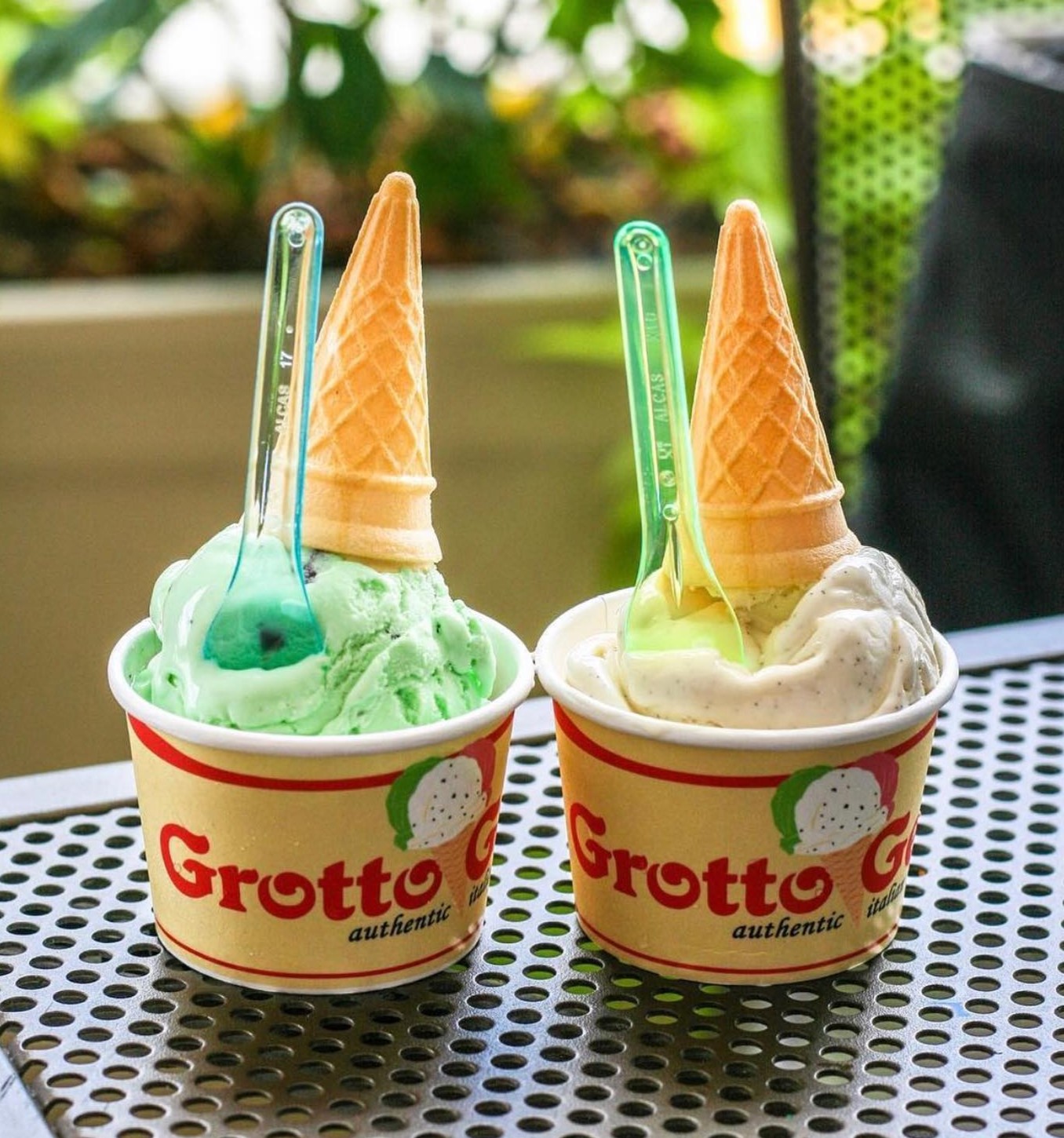 two cups of gelato with cones on top