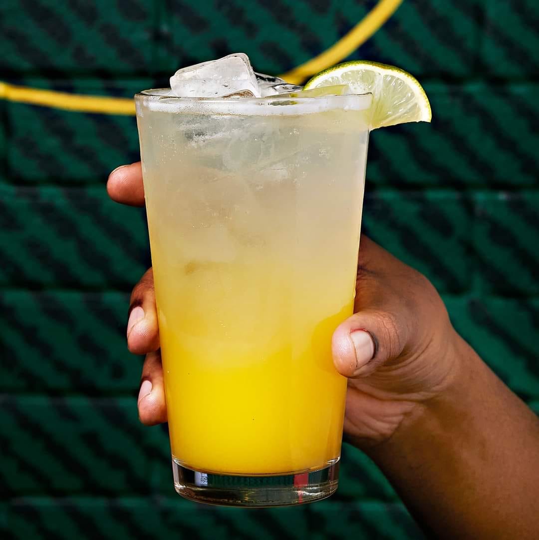 a Passionfruit Sparkler with a lime wedge